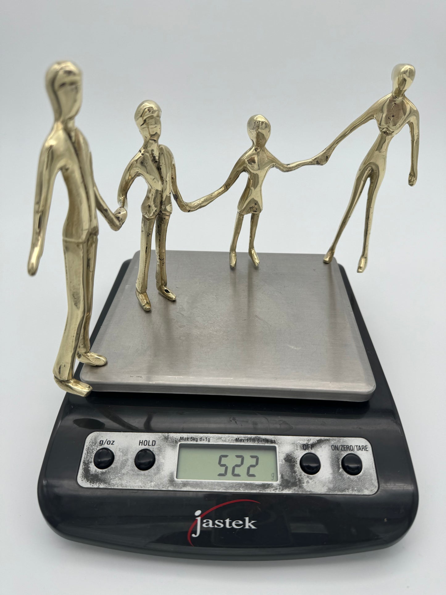 Family holding hands in line