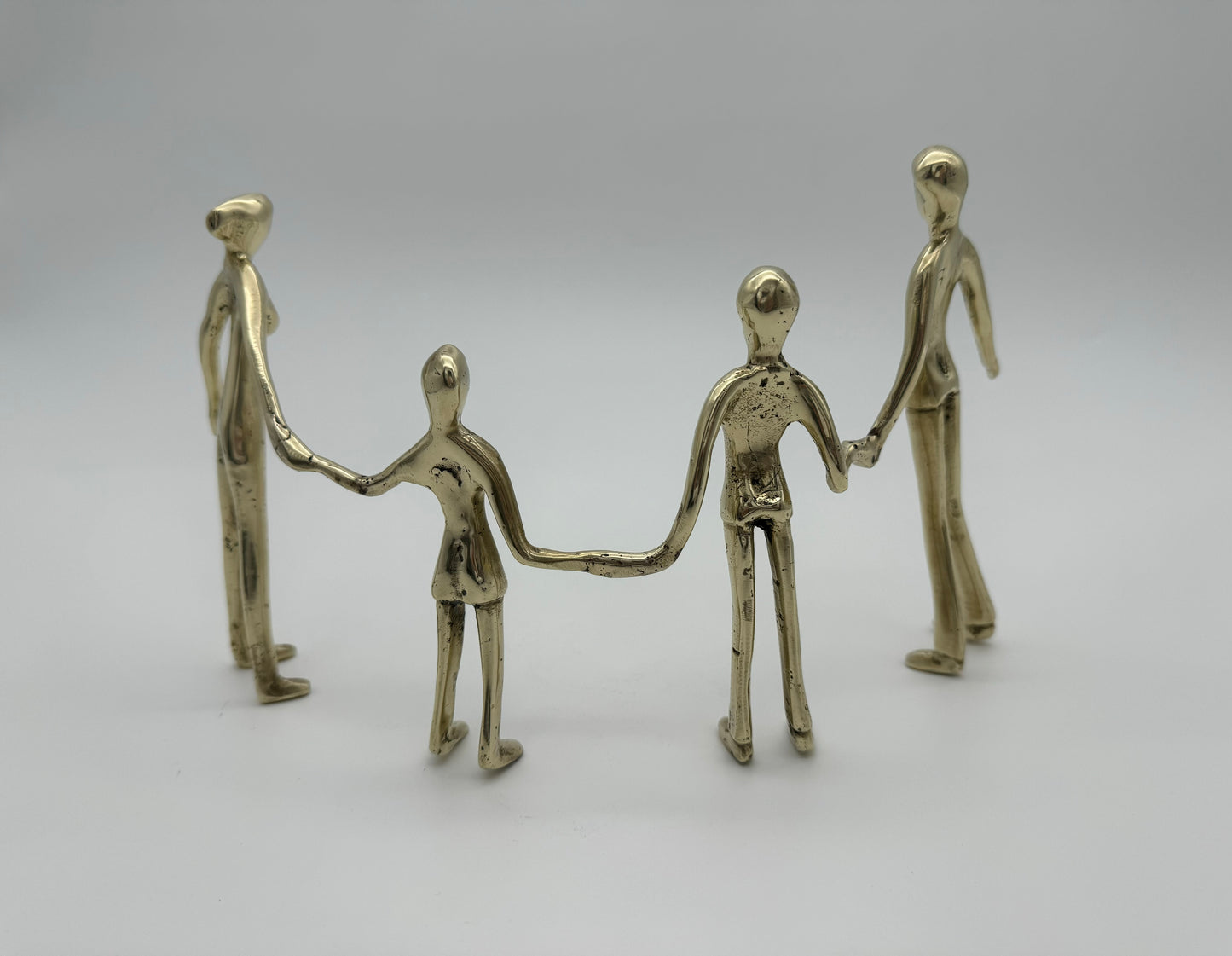 Family holding hands in line