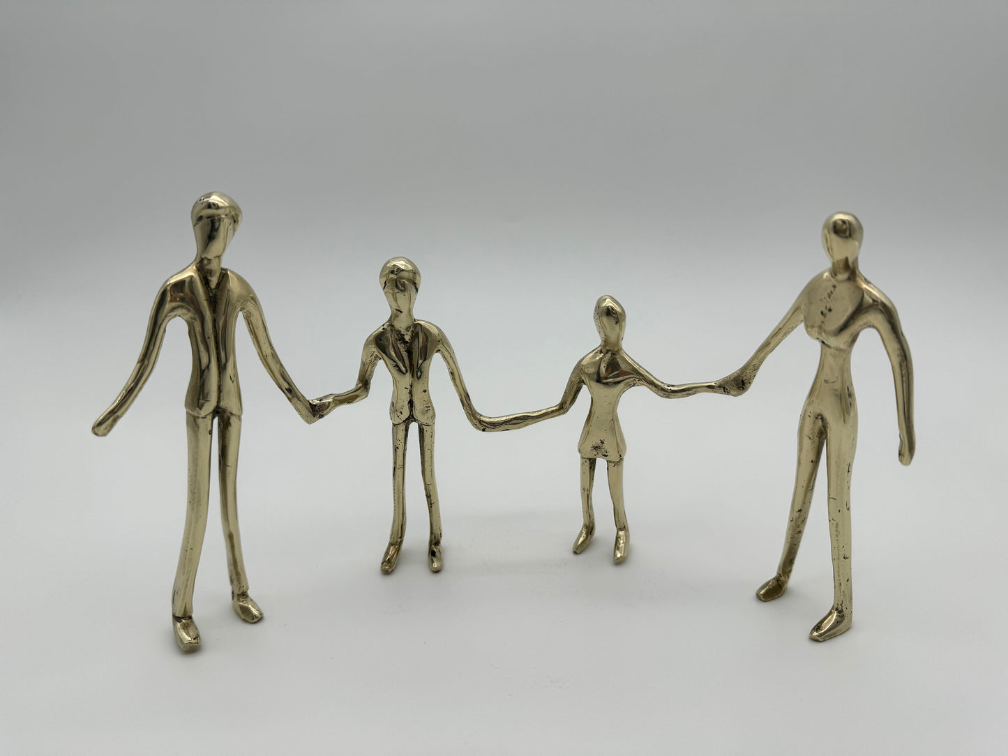Family holding hands in line